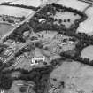 Oblique aerial view centred on the hospital before development, taken from the SW.