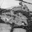 Oblique aerial view centred on the hospital before development, taken from the SE.