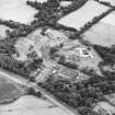 Oblique aerial view centred on the hospital before development, taken from the NW.