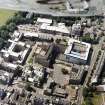 Oblique aerial view centred on the hospital, taken from the ENE.