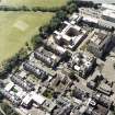 Oblique aerial view centred on the hospital, taken from the NE.