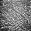 Oblique aerial view of Edinburgh centred on Merchiston.