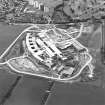 Oblique aerial view centred on the Royal Infirmary of Edinburgh at Little France under construction, taken from the E.