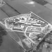 Oblique aerial view centred on the Royal Infirmary of Edinburgh at Little France under construction, taken from the NW.