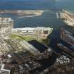 Oblique aerial view of Leith centred on the Ocean Terminal with Victoria Quay adjacent, taken from the SE.