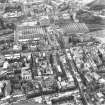 Oblique aerial view of centre of Edinburgh including St James' Centre at top of photograph, Jeffrey Street at right, Old College at bottom and St Giles' Cathedral at left.