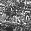 Aerial view showing North and South Bridges running top to bottom of photograph, with High Street at bottom, St Mary's Street and Pleasance to left and Old College to right