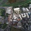 Oblique aerial view centred on the construction of the Scottish Parliament with exhibition centre adjacent, taken from the NNW.