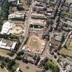 Oblique aerial view centred on the Scottish Parliament under construction with 'Our Dynamic Earth' adjacent, taken from the NE.