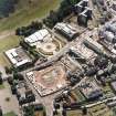 Oblique aerial view centred on the Scottish Parliament under construction with 'Our Dynamic Earth' adjacent, taken from the N.