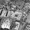 Oblique aerial view centred on the Scottish Parliament under construction with 'Our Dynamic Earth' adjacent, taken from the SE.