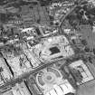 Oblique aerial view centred on the Scottish Parliament under construction with 'Our Dynamic Earth' adjacent, taken from the SSE.