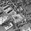 Oblique aerial view centred on the Scottish Parliament under construction with 'Our Dynamic Earth' adjacent, taken from the E.