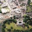 Oblique aerial view centred on the construction of the Scottish Parliament with the exhibition centre and palace adjacent, taken from the E.