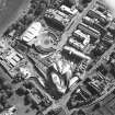 Oblique aerial view centred on the construction of the Scottish Parliament with the exhibition centre and palace adjacent, taken from the NNE.