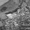 Oblique aerial view of Edinburgh centred on the construction of the Scottish Parliament, taken from the NNE.