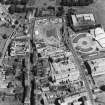 Oblique aerial view centred on the Scottish Parliament under construction with 'Our Dynamic Earth' adjacent, taken from the WSW.