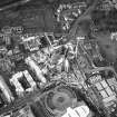 Oblique aerial view centred on the construction of the Scottish Parliament, taken from the S.