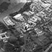 Oblique aerial view centred on the construction of the Scottish Parliament with the exhibition centre adjacent, taken from the N.