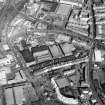 Oblique aerial view centred on the bonded warehouse with the park and bowling green adjacent, taken from the WSW.