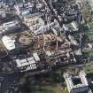 Oblique aerial view centred on the construction of the Scottish Parliament, with `Our Dynamic Earth¿, Queensberry House and Holyrood Palace adjacent, taken from the E.