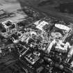 Oblique aerial view centred on the construction of the Scottish Parliament, with `Our Dynamic Earth¿, Queensberry House and Holyrood Palace adjacent, taken from the NW.
