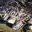 Oblique aerial view centred on the construction of the Scottish Parliament with Our Dynamic Earth and Queensbury House adjacent, taken from the SE.