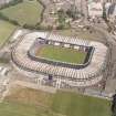 Edinburgh, Murrayfield Stadium, oblique aerial view, taken from the SW, centred on Murrayfield Stadium. Roseburn House is visible in the top centre half of the photograph.