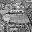 Edinburgh, Murrayfield Stadium, oblique aerial view, taken from the WSW, centred on Murrayfield Stadium. Murrayfield Ice Rink and Roseburn House are visible in the centre of the photograph.