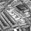 Oblique aerial view centred on Sinclair Place with bakery, factory and brewery adjacent, taken from the N.