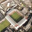 Oblique aerial view of Edinburgh centred on Tynecastle Park Stadium, taken from the SW.