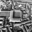 Oblique aerial view of Edinburgh centred on Tynecastle Park Stadium and the North British Distillery, taken from the SSE.