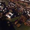 Oblique aerial view of Edinburgh centred on Holyrood Palace, taken from the SE.