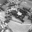 Dirleton Castle, oblique aerial view, taken from the WNW. The cropmark of a possible building is visible on Dirleton Village Green in the foreground.
