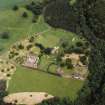 Oblique aerial view of Dunglass centred on the Collegiate Church with Dunglass House stables adjacent, taken from the SW.