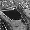 Oblique aerial view of the Cockenzie Coal Store centred on the Coal Store, taken from the SW.