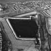 Oblique aerial view of the Cockenzie Coal Store centred on the Coal Store, taken from the SW.