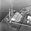 Oblique aerial view of the Cockenzie Generating Station centred on the power station with the  harbour adjacent, taken from the S.