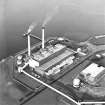 Oblique aerial view of the Cockenzie Generating Station centred on the power station with the  harbour adjacent, taken from the SE.