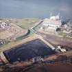 Oblique aerial view centred on the power station and coal store, taken from the ESE.