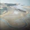 Oblique aerial view centred on the remains of the embankment of the failed land reclamation, taken from the SSW.