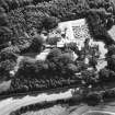 Oblique aerial view of house, gardens, stables and doocot from N.