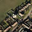 Oblique aerial view of the Carrington Parish Church centred on the church with a general view of the burgh, village, taken from the S.