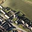 Oblique aerial view of the Carrington Parish Church centred on the church with a general view of the burgh, village, taken from the E.