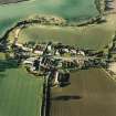 Oblique aerial view of Carrington, General centred on the burgh:village with an adjacent church, taken from the S.