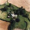 Oblique aerial view centred on the country house with garden adjacent, taken from the WSW.
