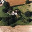 Oblique aerial view centred on the country house with garden adjacent, taken from the SSE.