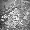 Oblique aerial view centred on Inveresk Gate, church and burial-ground, taken from the NE.