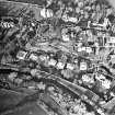 Oblique aerial view centred on Inveresk Gate, church and burial-ground, taken from the SSE.