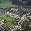 Oblique aerial view centred on the village and miners' rows, taken from the NW.